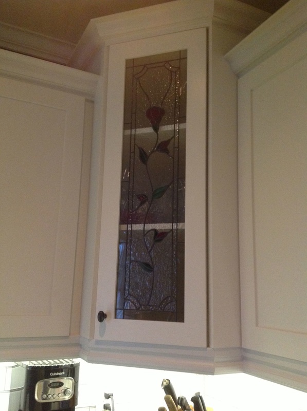 Picture custom stained glass door, crown molding, custom kitchen